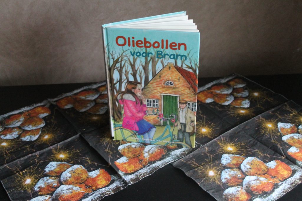 Boek, oliebollen, servetten